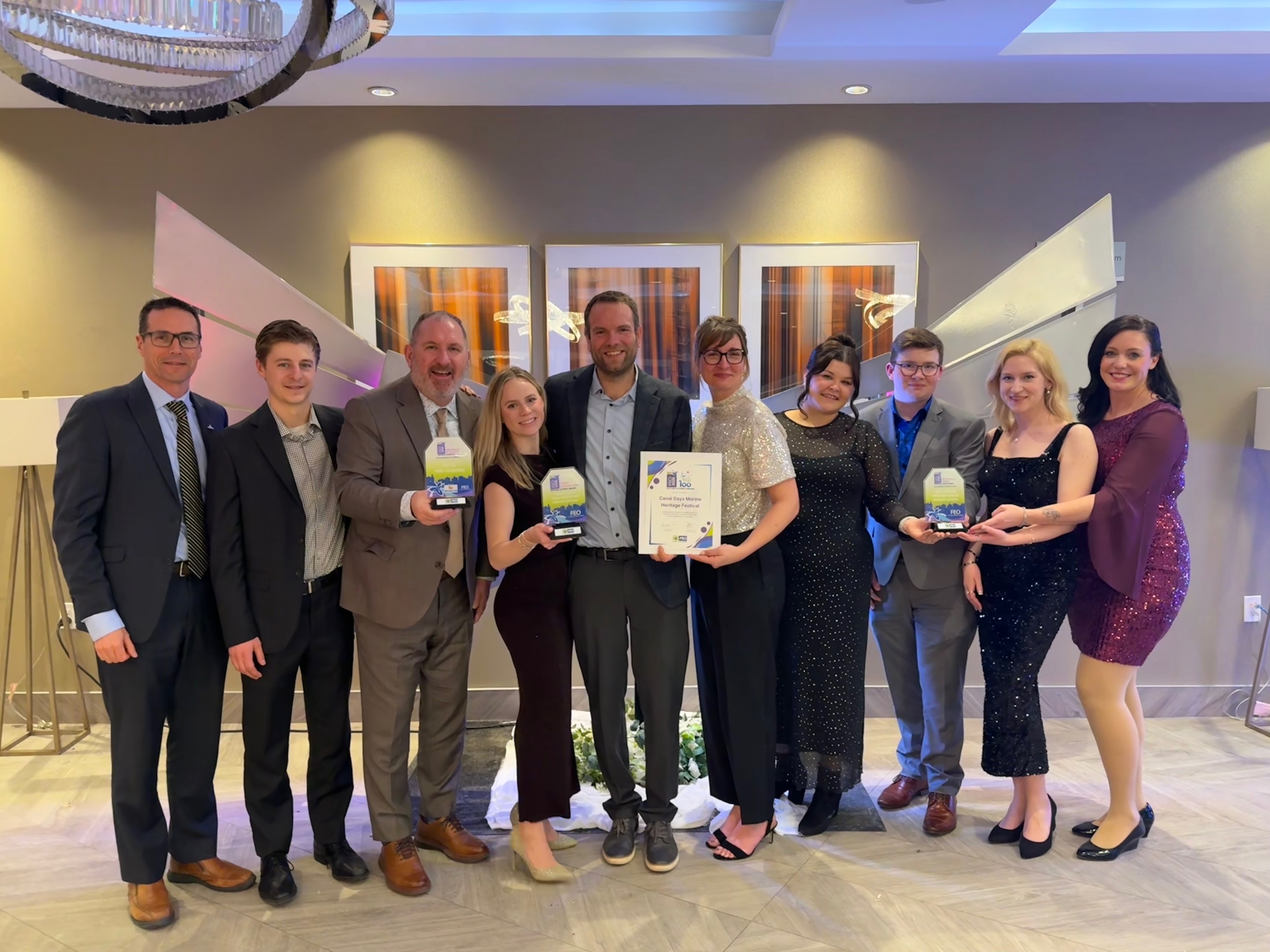 Group of staff holding awards