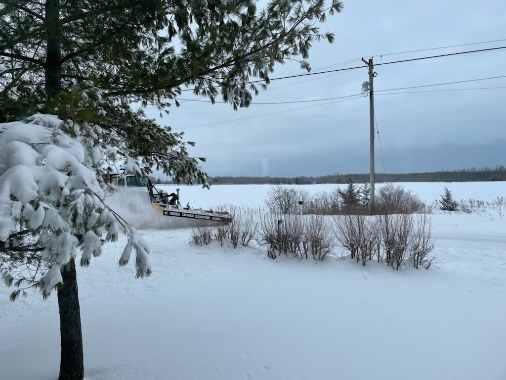 Snow plow pushing snow