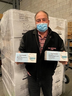 Fire Chief Tom Cartwright holds non-medical masks that will be handed out to the community.