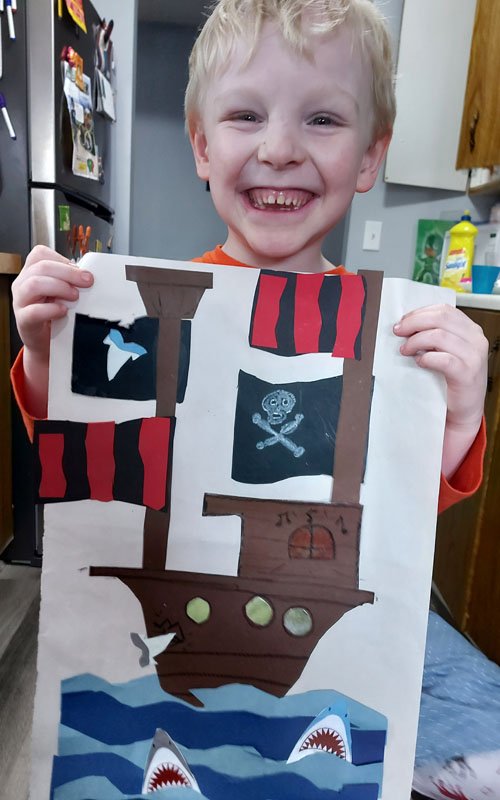 Child showing Pirate Ship craft
