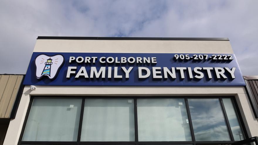 Sign for Port Colborne Family Dentistry, featuring a tooth graphic and contact number.