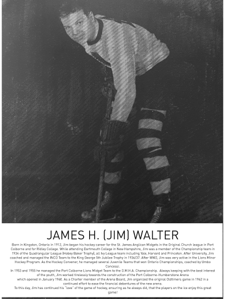 Black and white photograph of a man in a vintage hockey uniform, holding a hockey stick.