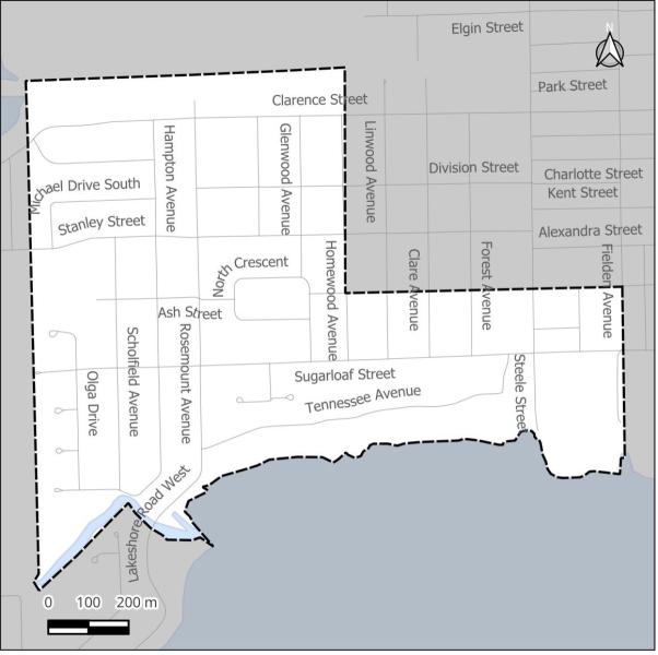 Map outlining streets and neighbourhoods, featuring a water boundary at the bottom.