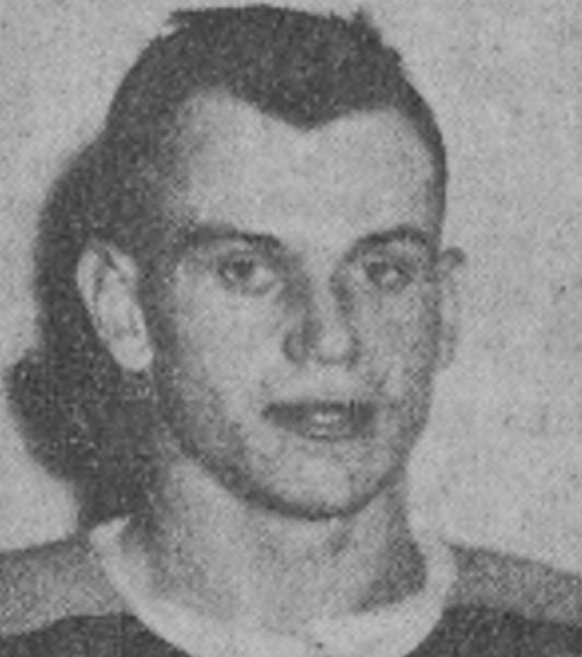 Black and white photograph of a young athlete with a serious expression.